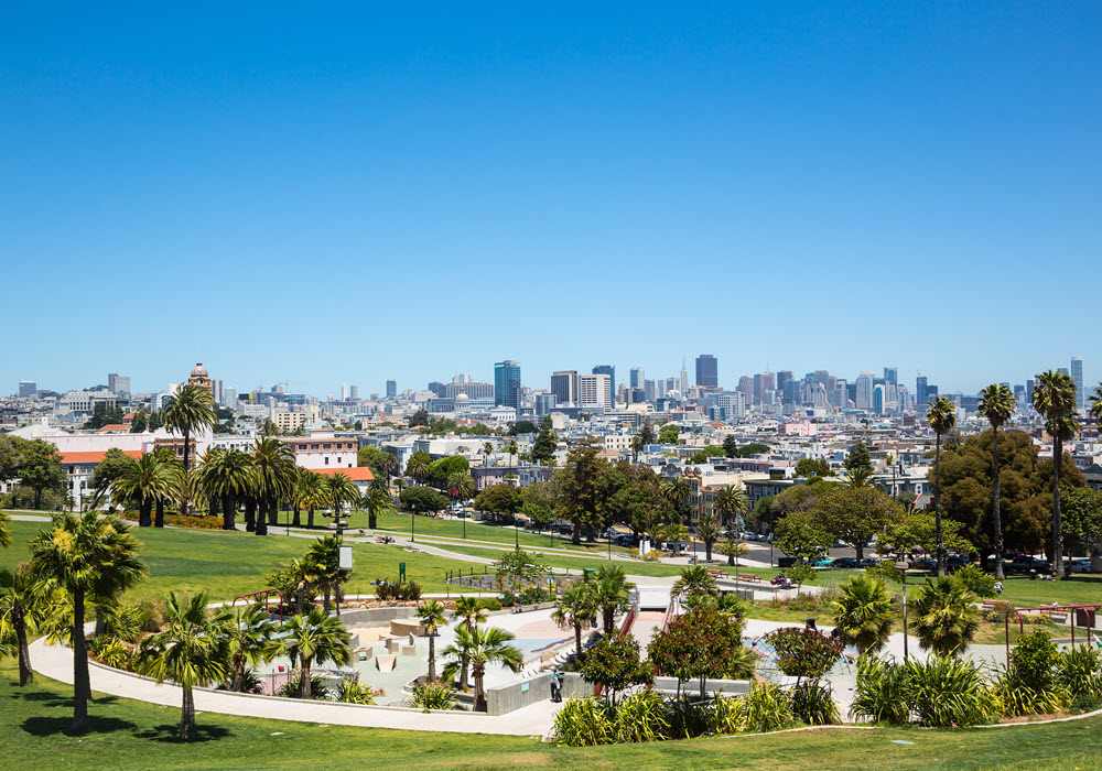 Dolores Park in San Francisco, California with the city skyline in the background.