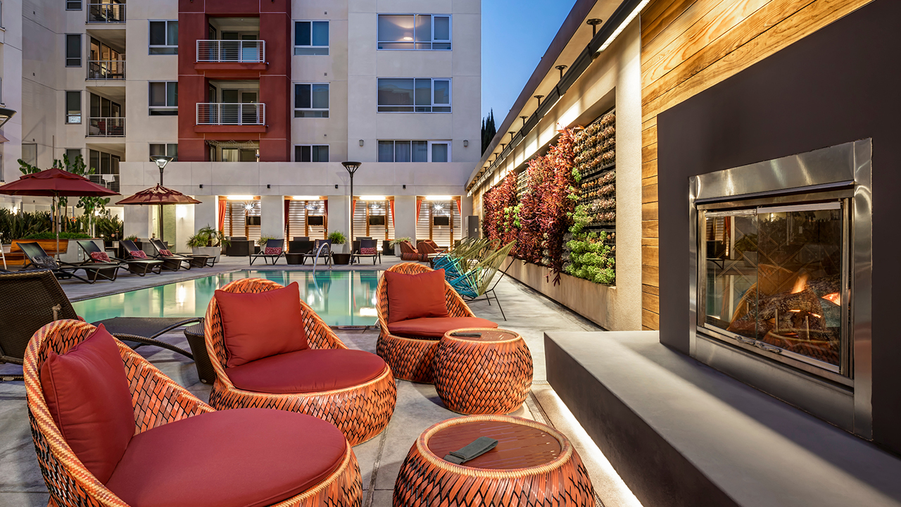 Firepit Area with lounge seating adjacent to outdoor swimming pool area