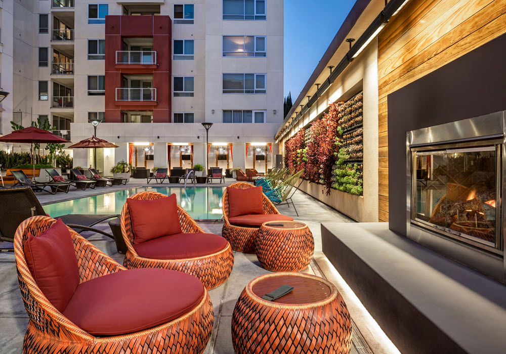 The Huxley outdoor fireplace area at dusk.